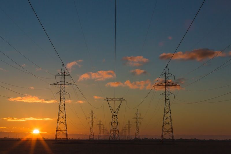 Transmission towers across an open landscape