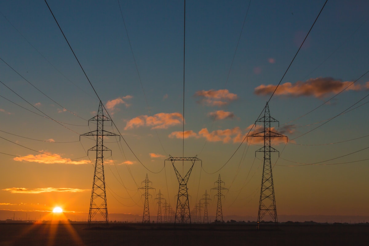 Transmission towers across an open landscape
