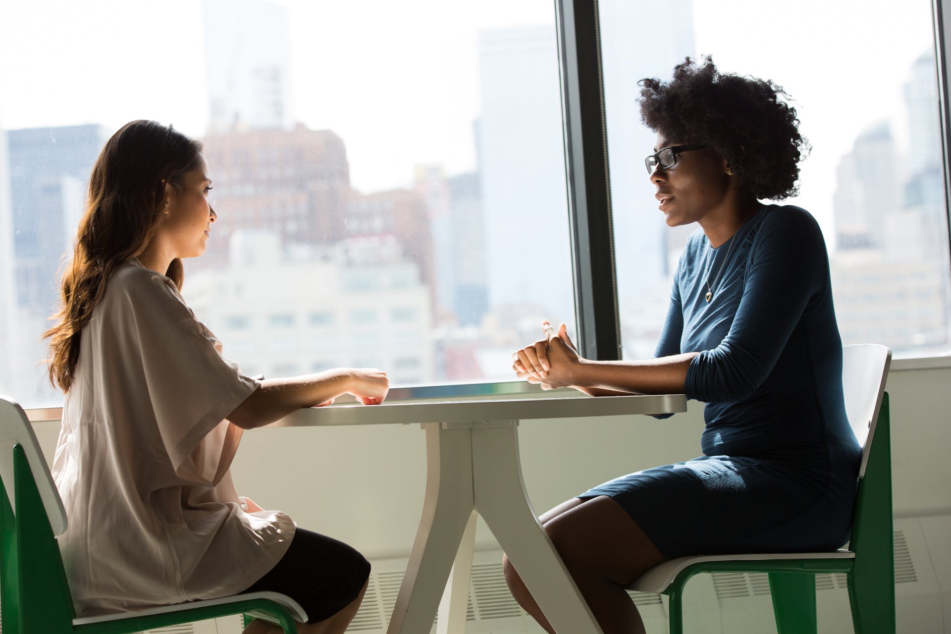 Leadership coaching conversation between two professionals